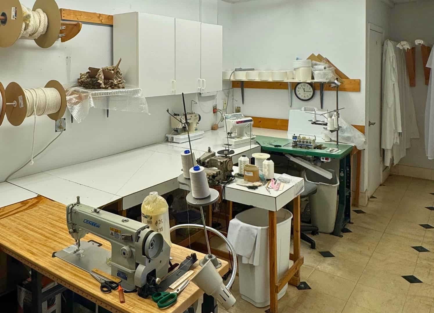 Custom window treatment workroom in Florida showing sewing machines
