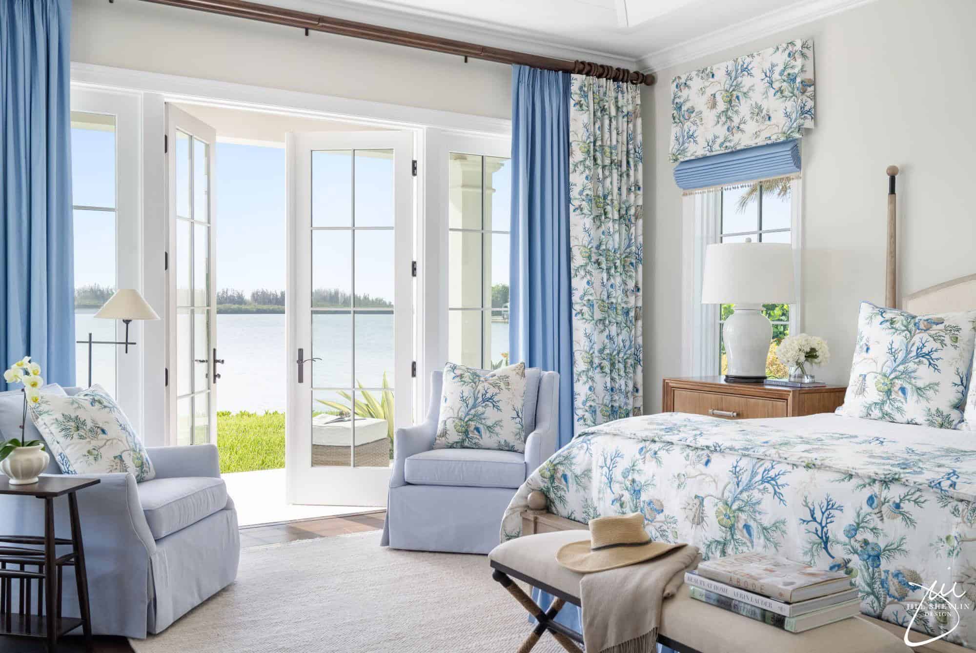 Blue bedroom with custom drapery Roman shade and coordinated soft goods