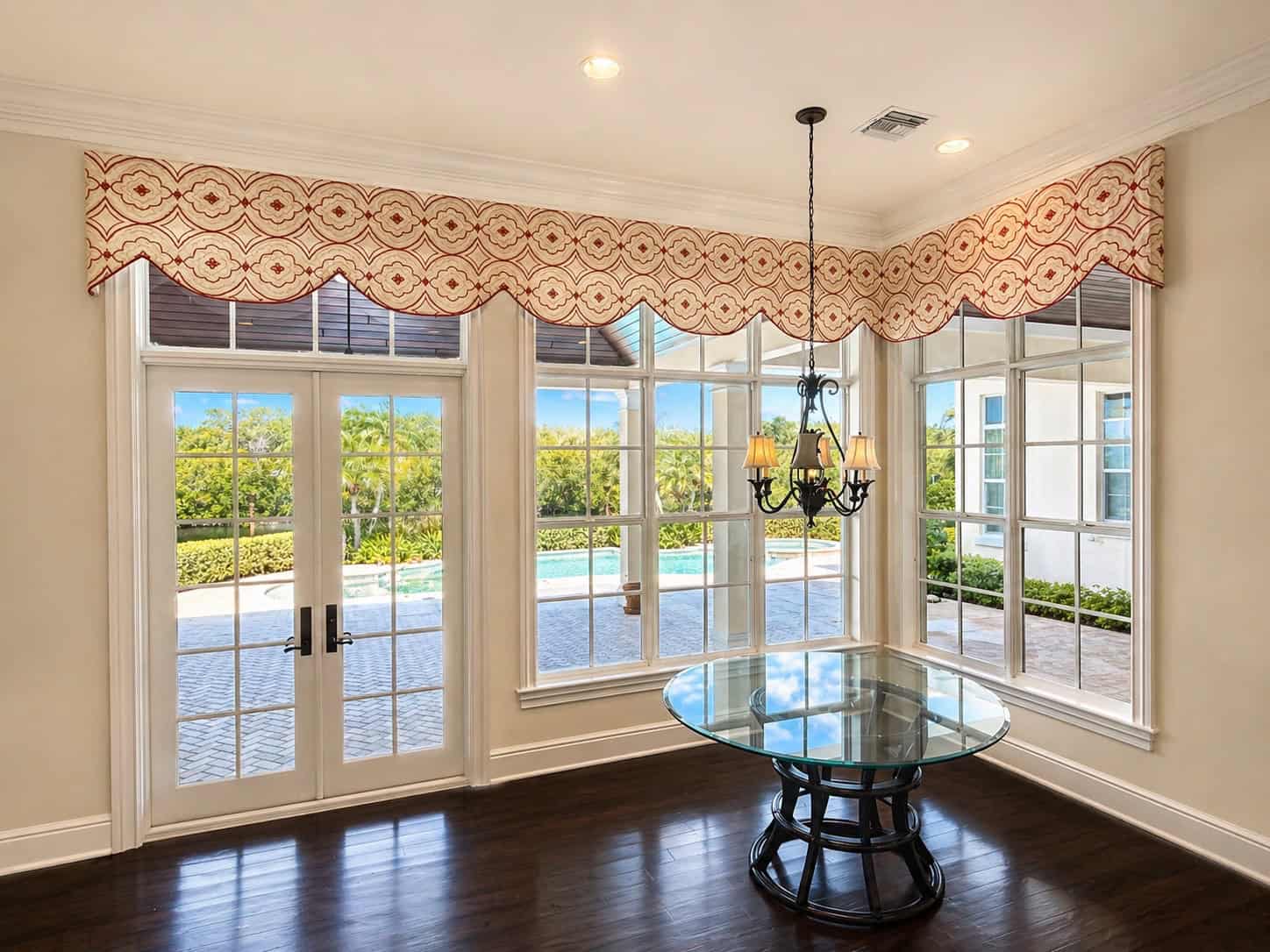 Custom scalloped valance and hard window treatment for a Florida dining room